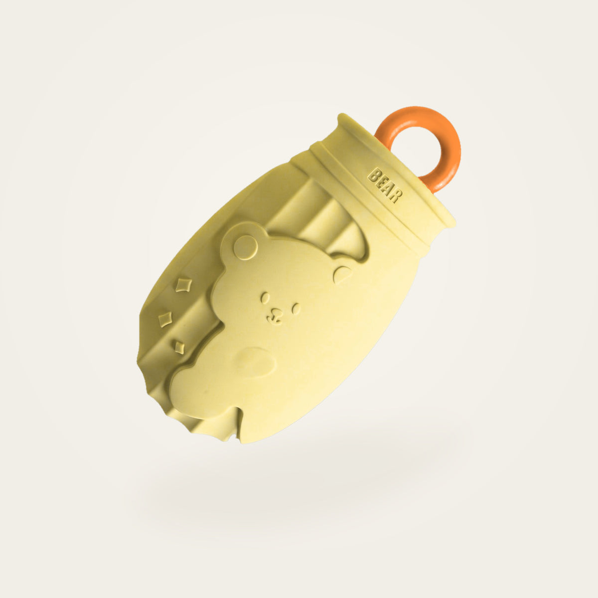 Bouillotte à eau jaune, motif ours en relief, fond crème