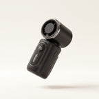Ventilateur clip portable Hélios, coloris Noir, vue posée sur fond crème