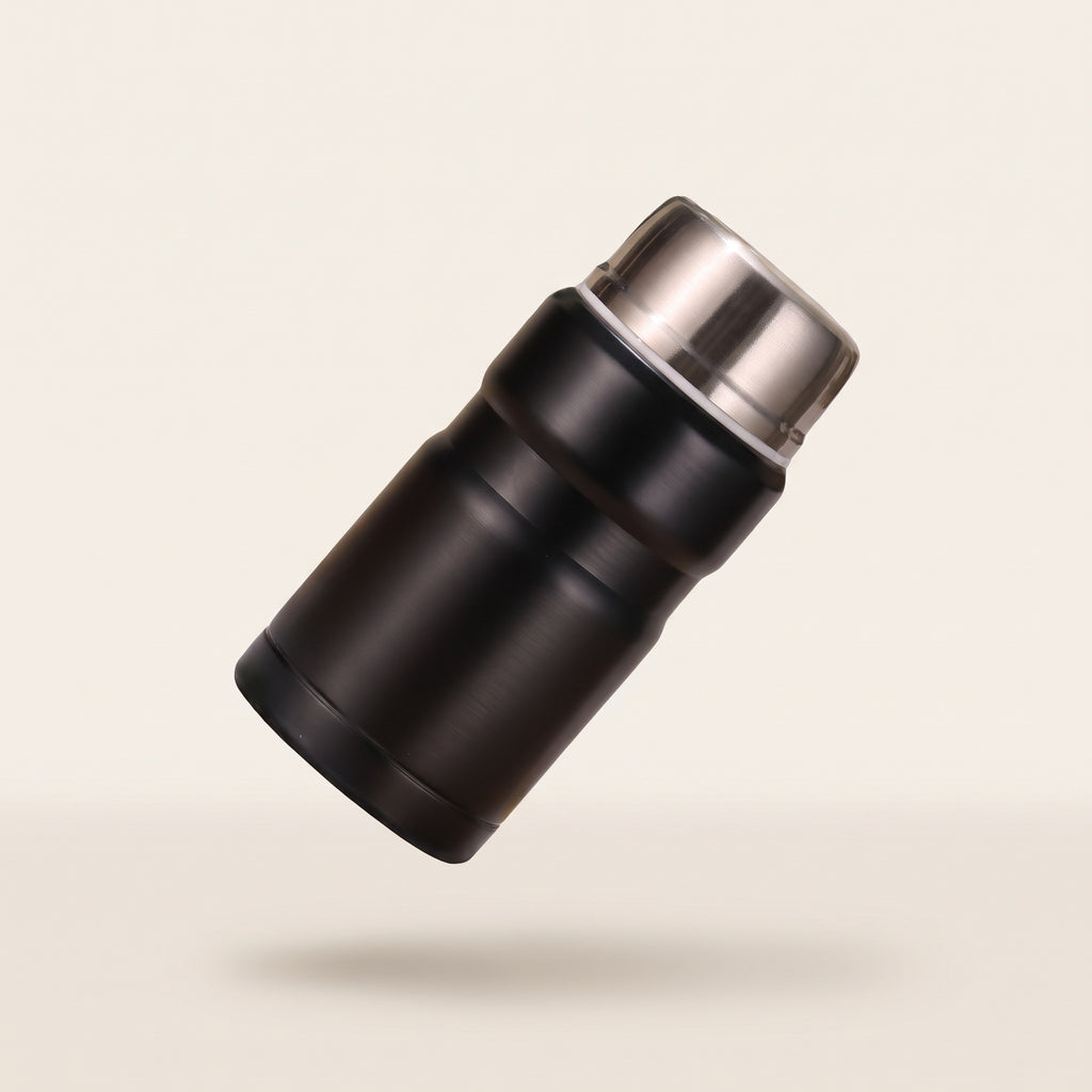 Pot-repas isotherme Hélios en inox, coloris noir à couvercle inox, fond crème