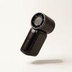 Mini ventilateur de poche USB Hélios, coloris Noir, fond crème