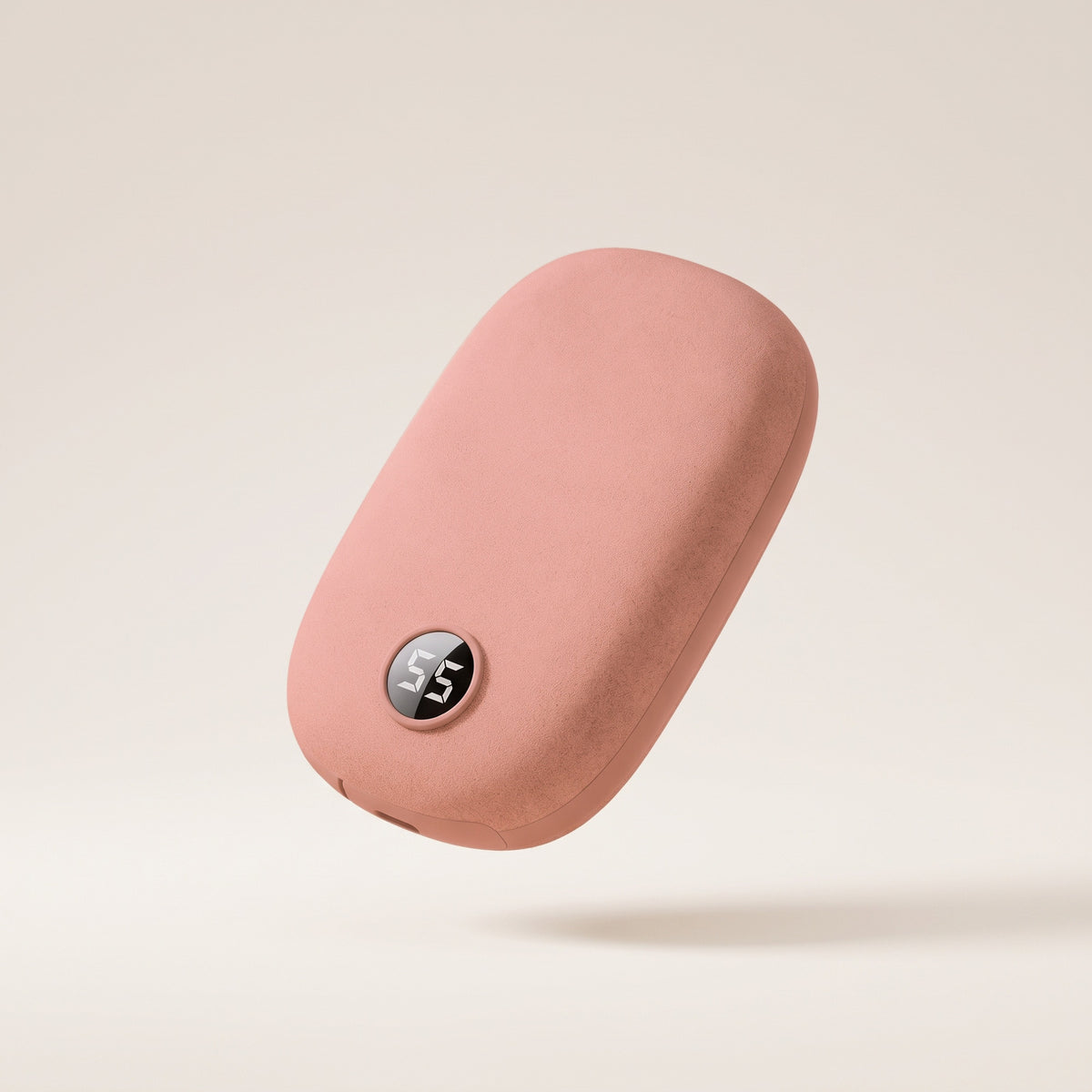 Chauffe-mains en suédine rose pêche, afficheur de température, fond crème
