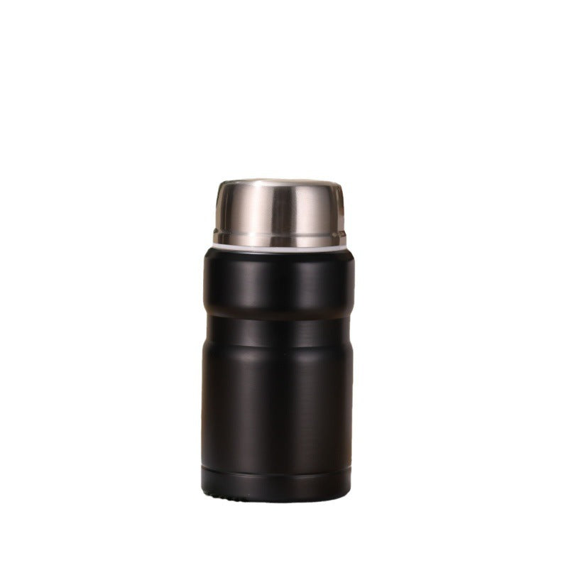 Packshot du pot noir mat à couvercle inox sur fond blanc, produit centré mais petit dans le cadre.